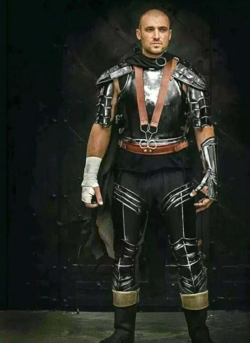 Person wearing a detailed armor set with a dark background