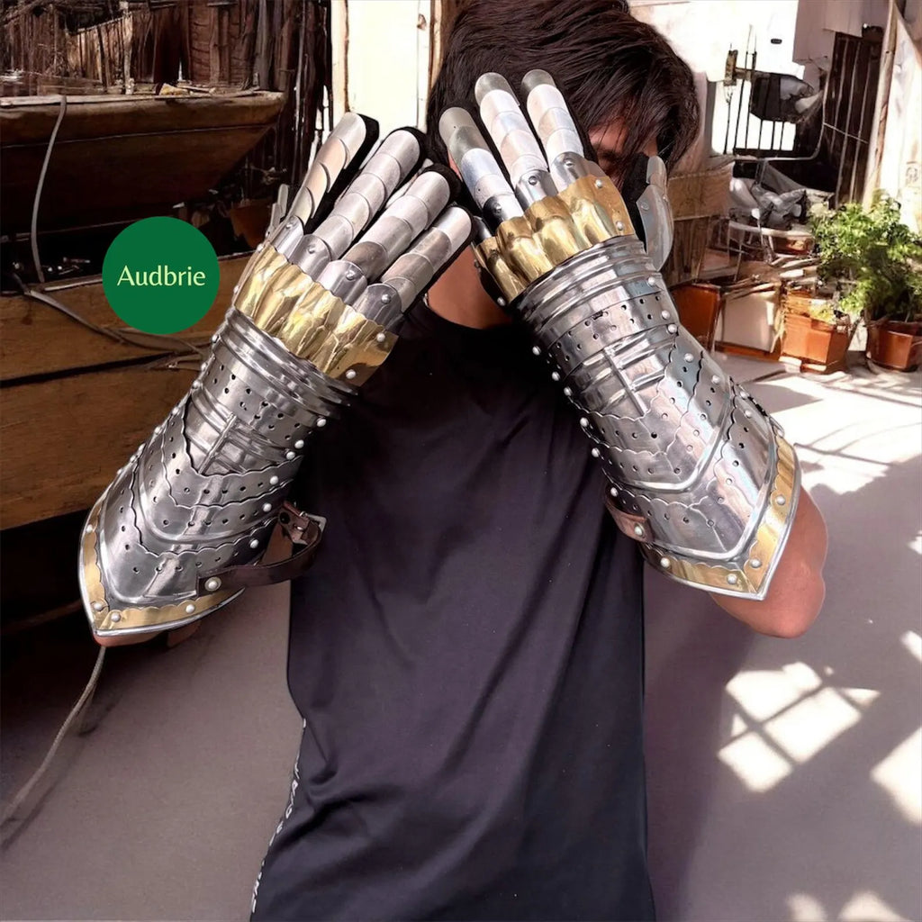Handcrafted articulated medieval steel gauntlets with brass knuckle plates worn on arms