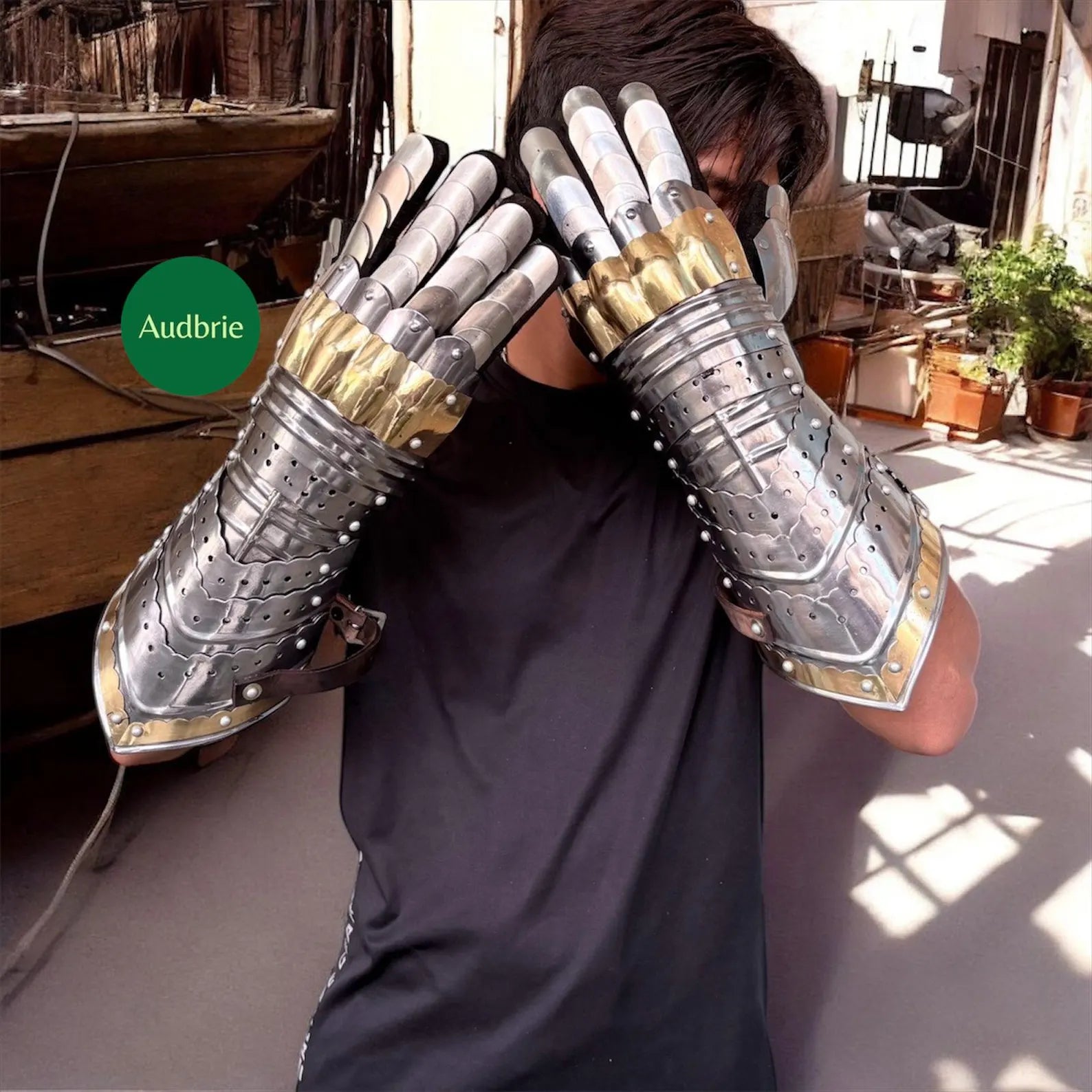 Handcrafted articulated medieval steel gauntlets with brass knuckle plates worn on arms