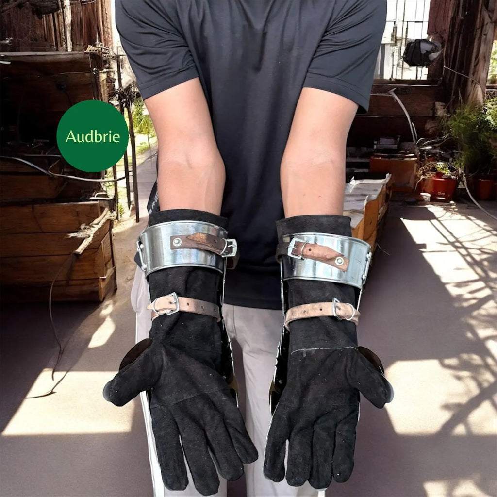 Handcrafted articulated medieval steel gauntlets with brass knuckle plates worn on arms