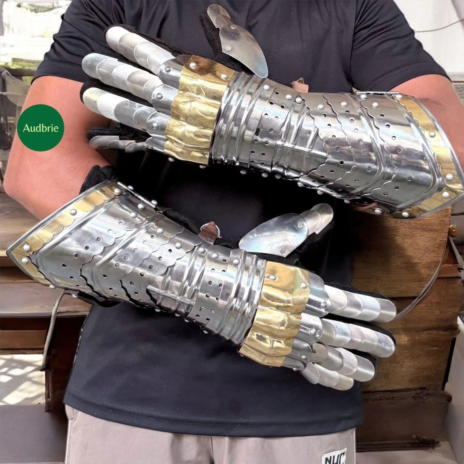 Handcrafted articulated medieval steel gauntlets with brass knuckle plates worn on arms
