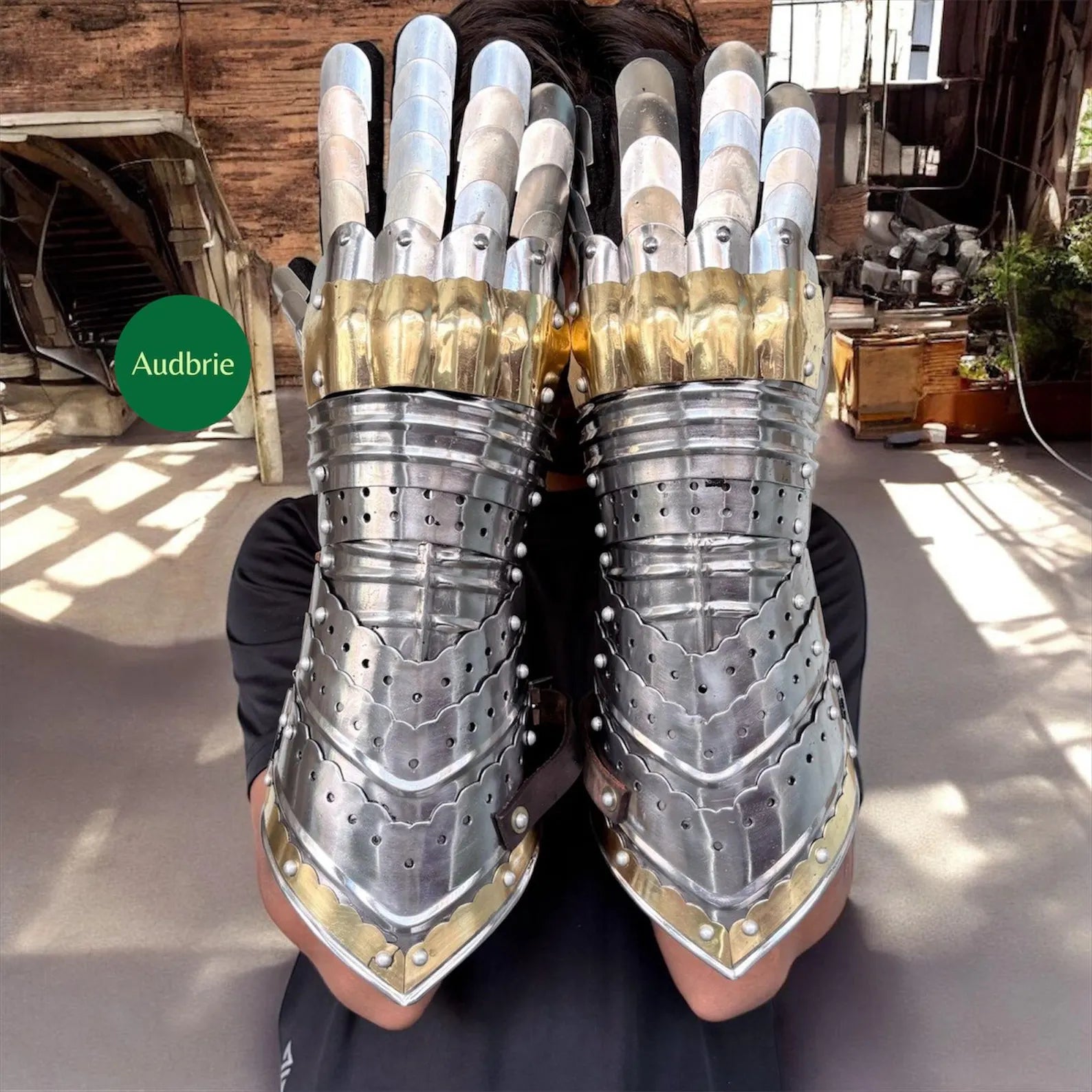 Handcrafted articulated medieval steel gauntlets with brass knuckle plates worn on arms