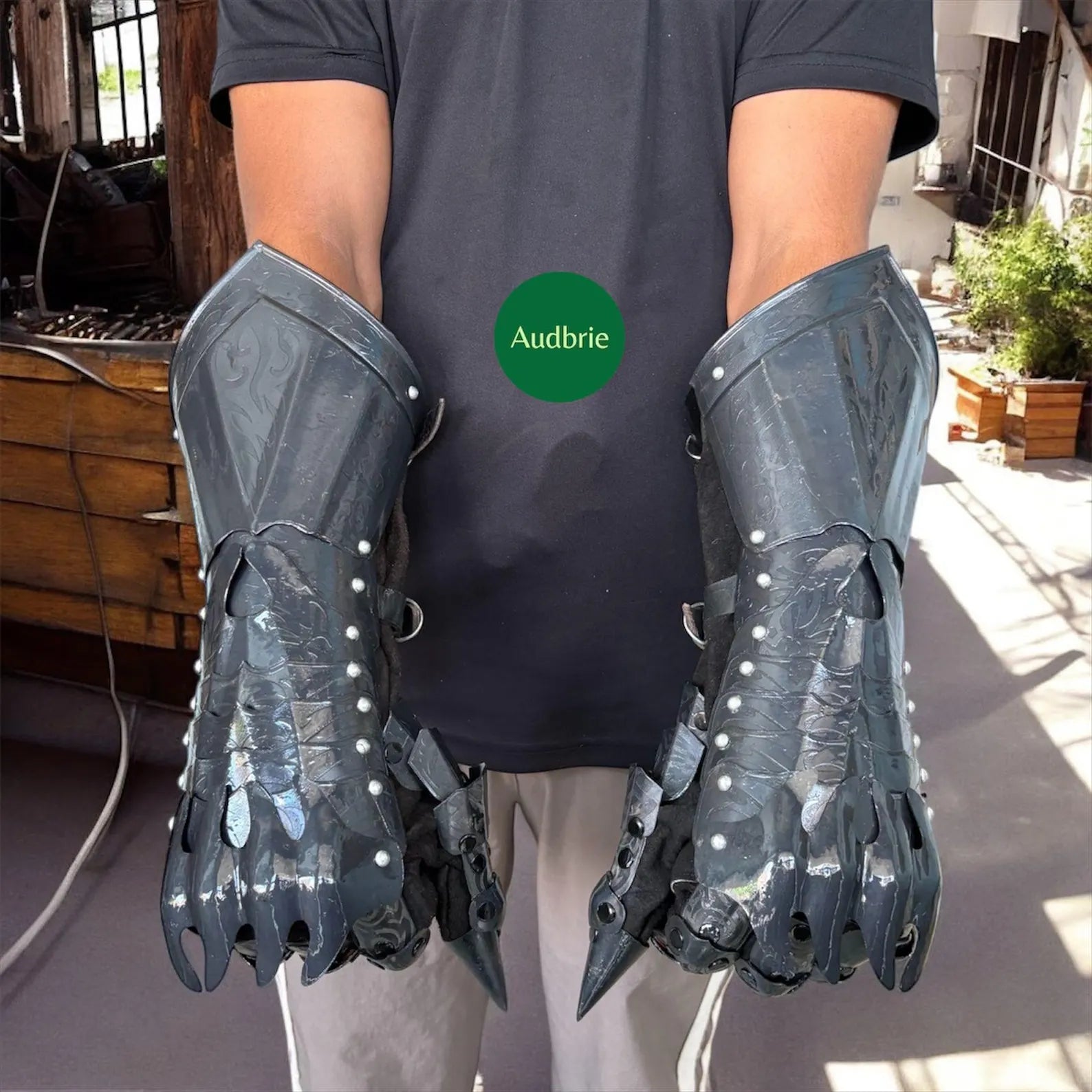 Handcrafted articulated medieval steel gauntlets with brass knuckle plates worn on arms
