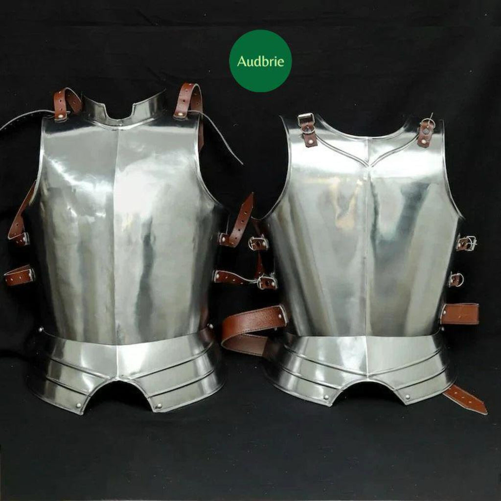 Woman wearing polished medieval steel armor suit with breastplate, pauldrons, and gauntlets while holding a sword.