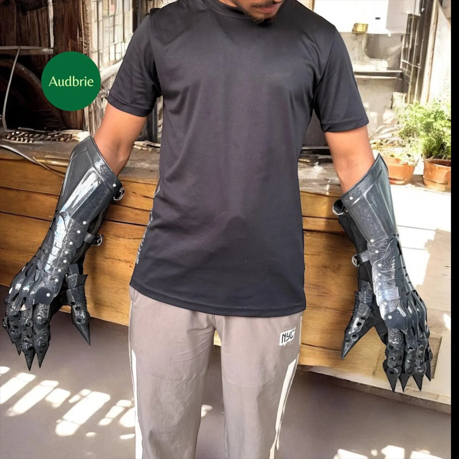 Handcrafted articulated medieval steel gauntlets with brass knuckle plates worn on arms