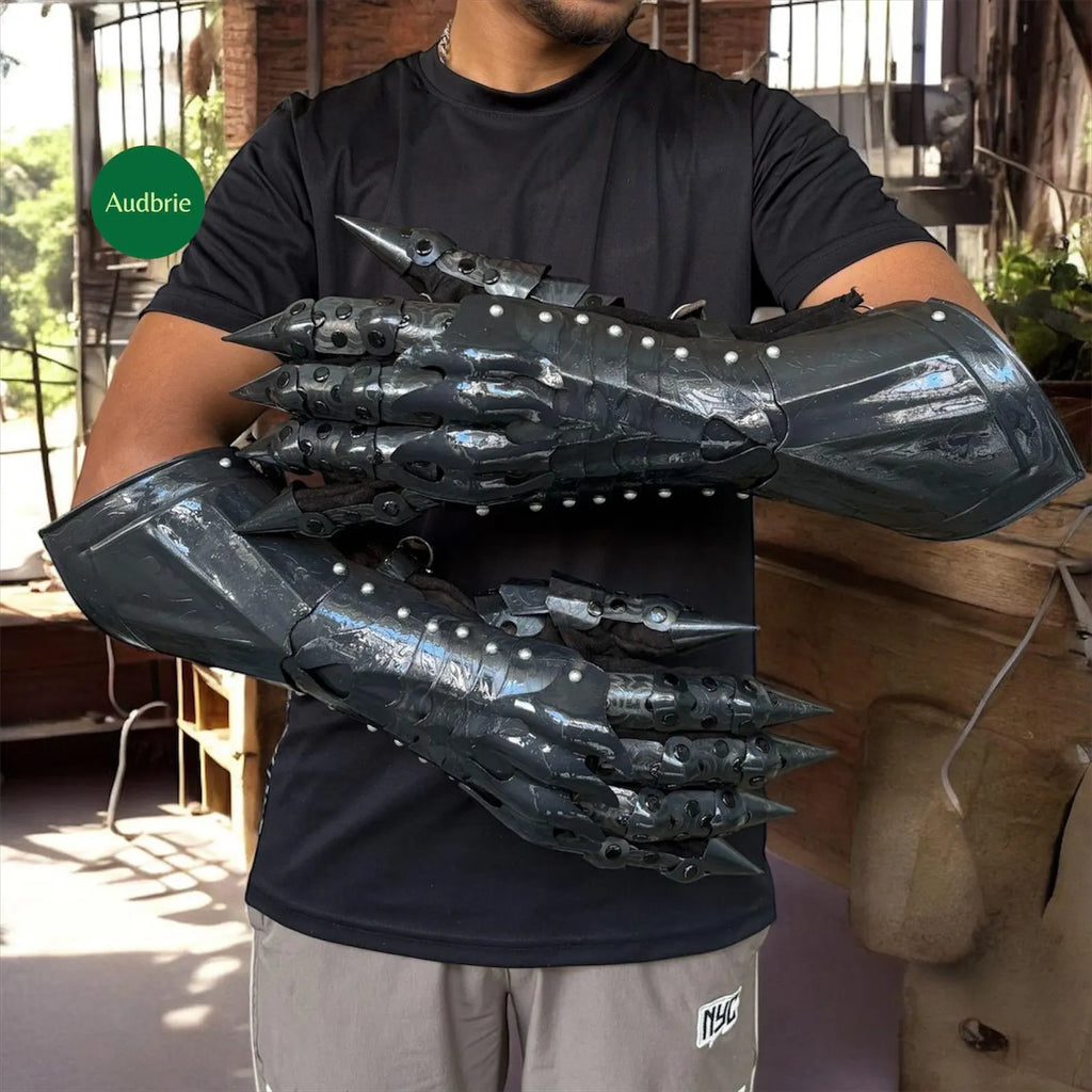 Handcrafted articulated medieval steel gauntlets with brass knuckle plates worn on arms