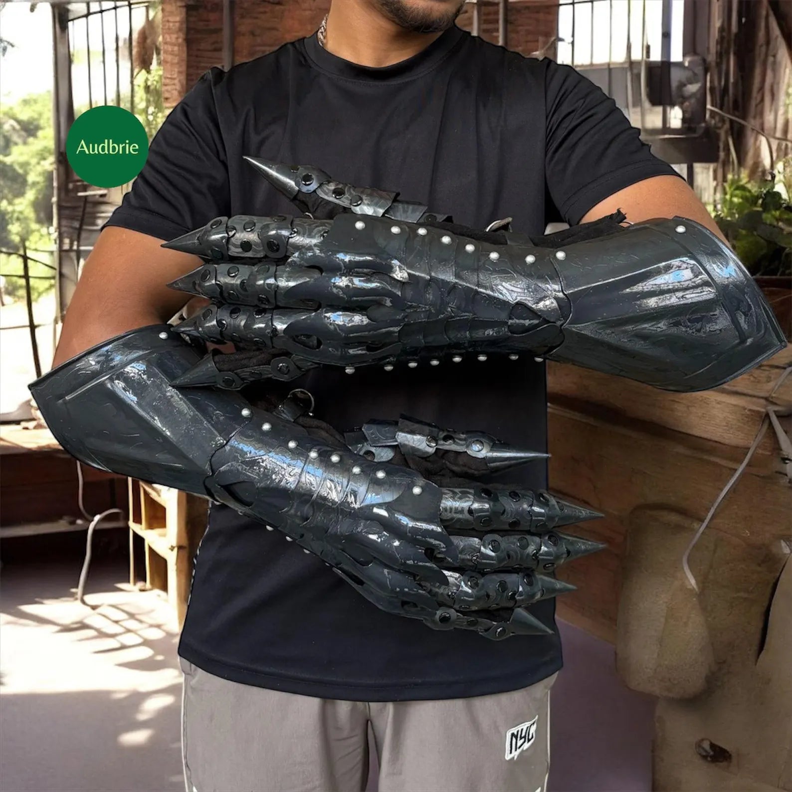 Handcrafted articulated medieval steel gauntlets with brass knuckle plates worn on arms