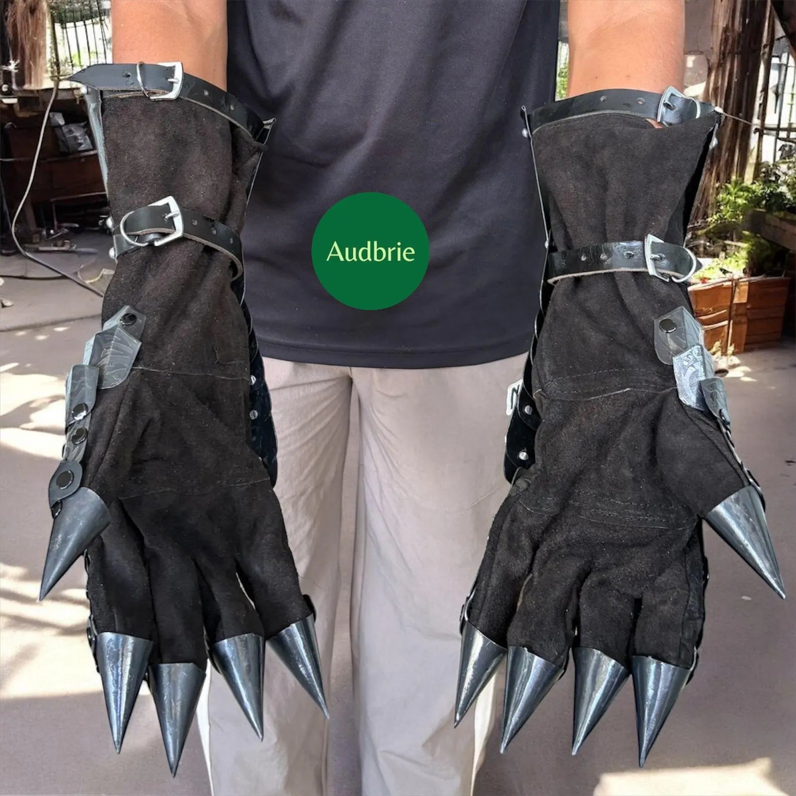 Handcrafted articulated medieval steel gauntlets with brass knuckle plates worn on arms