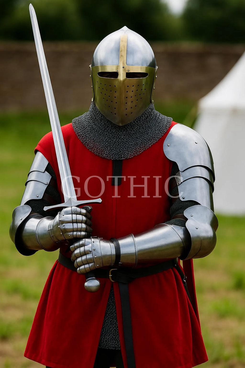 Person in full medieval armor holding a sword outdoors.